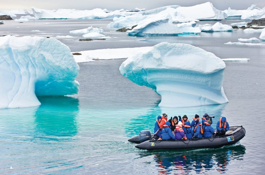 Guests exploring Antarctica via Zodiac